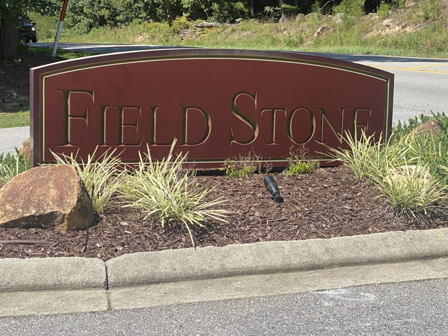 Unique Design Sign on Field Stone