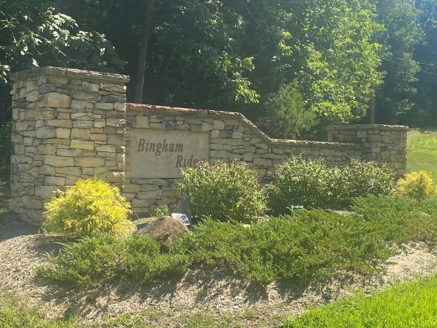 Bingham Ridge Name on a Wall and bushes around