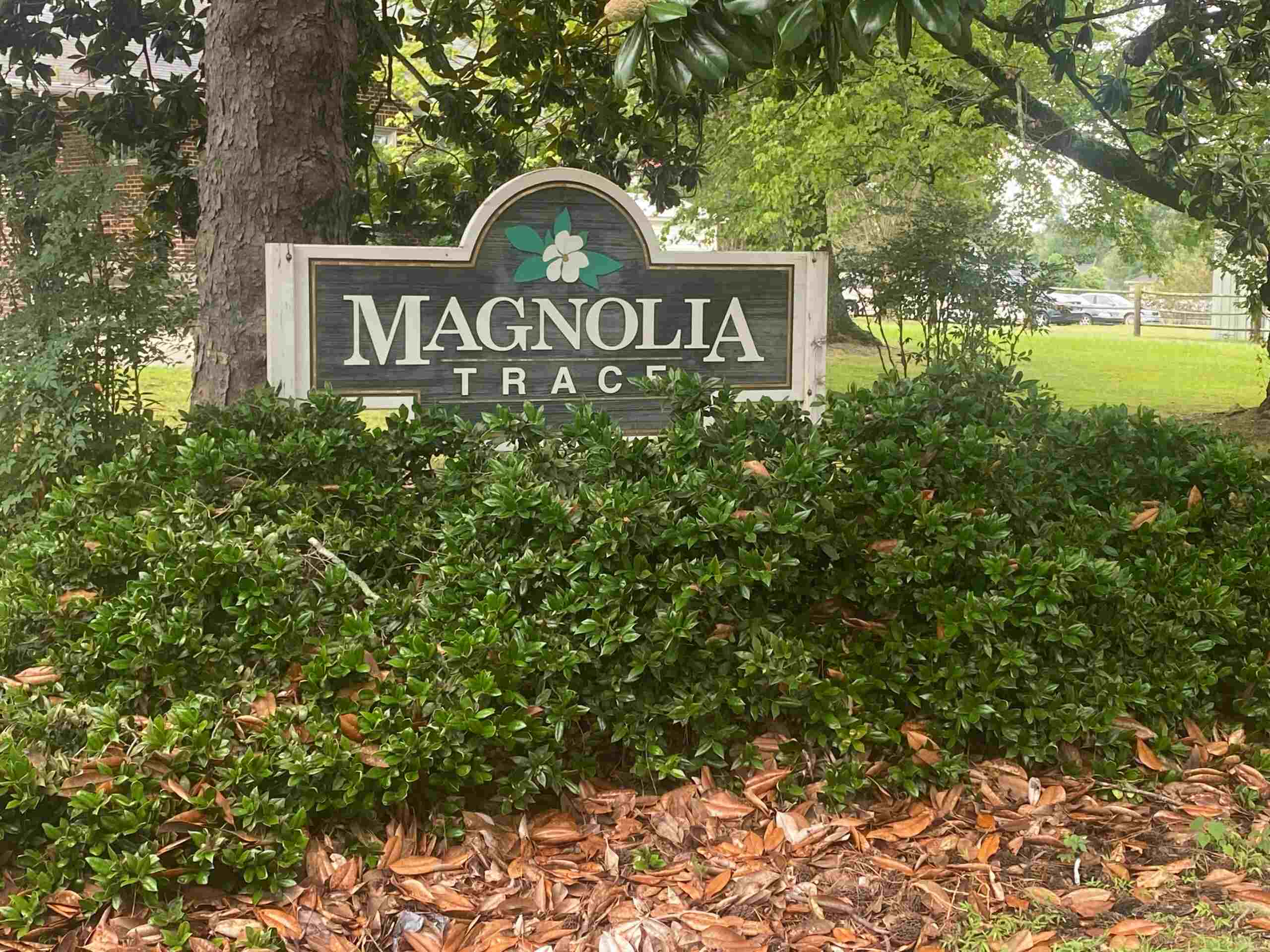 Magnolia Trace Name Board behind the bushes